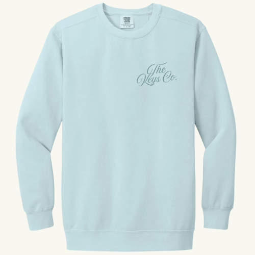 Light blue sweatshirt with 'The Keys Co.' logo on a white background