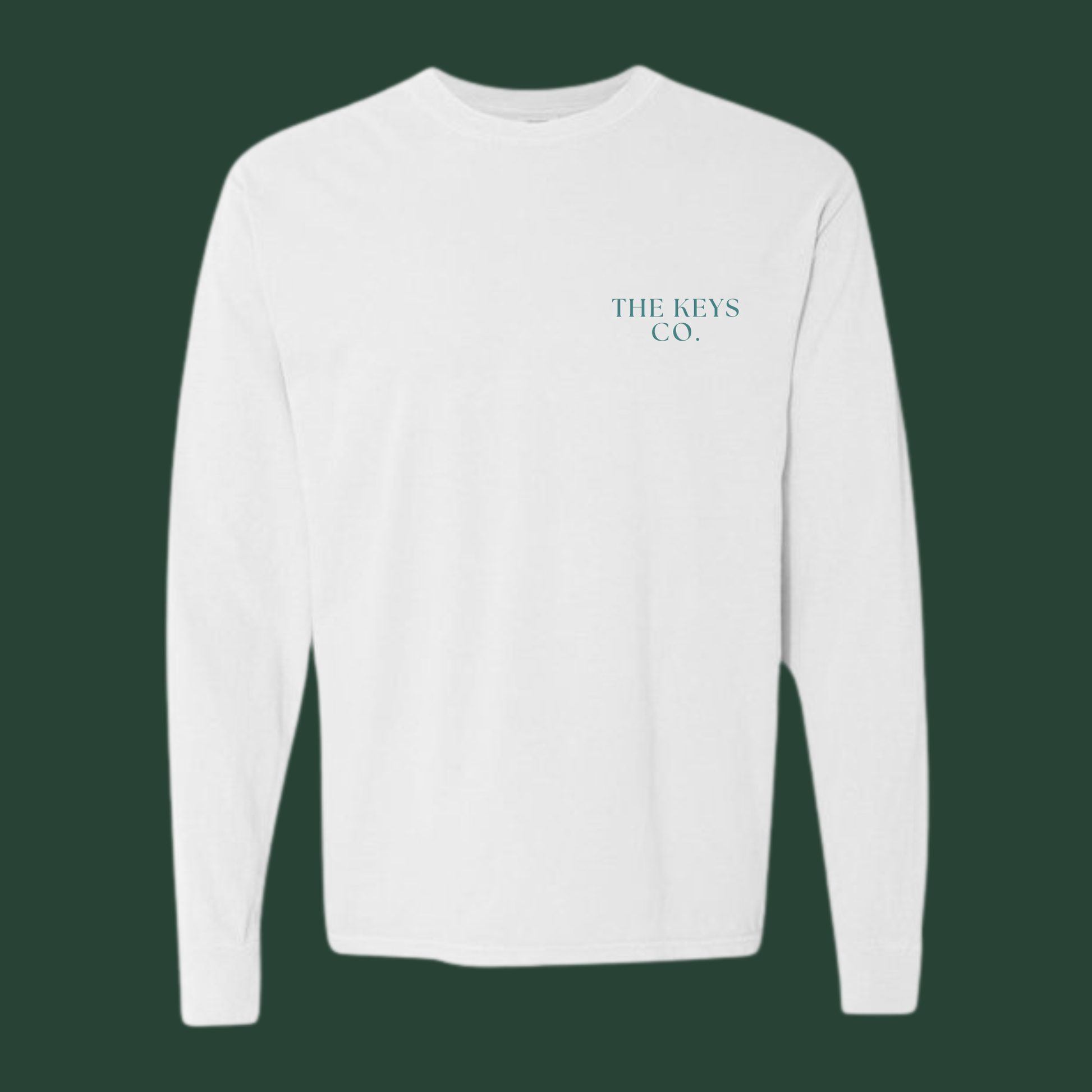 White long-sleeve shirt with 'THE KEYS CO.' logo on a dark green background