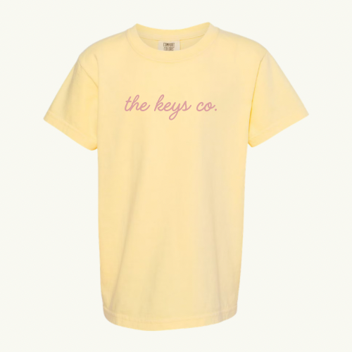 Yellow t-shirt with 'the keys co.' text on a white background